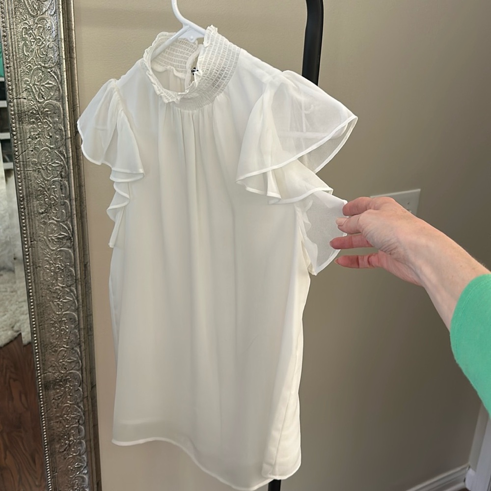 Sleeveless ruffle cap sleeve white top